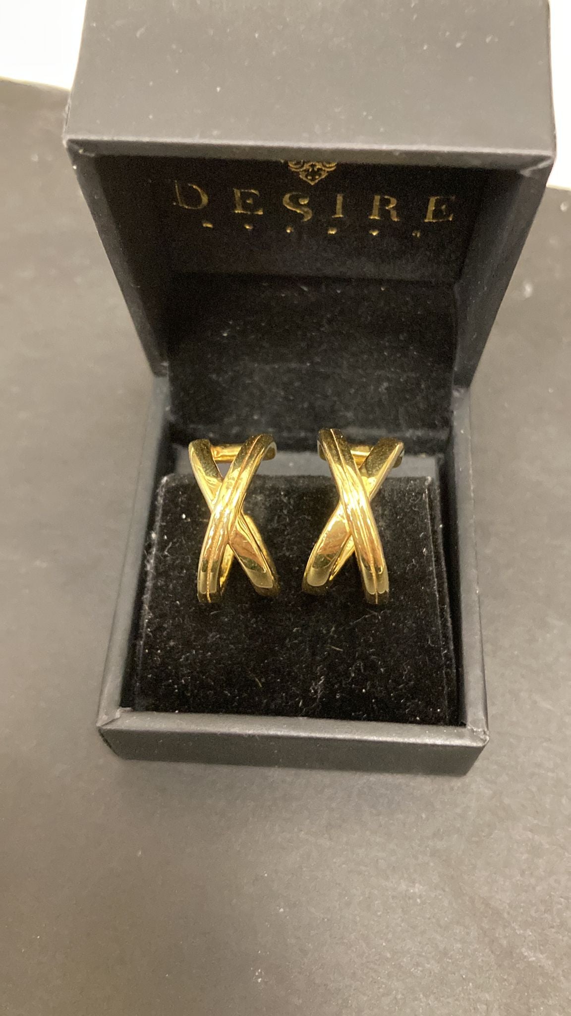 Sterling Silver Crossever X Earrings EP100117 displayed in a black box, featuring the focus keyword: sterling silver cross earrings.
