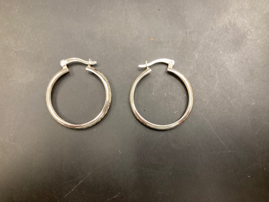 Sterling Silver Hoops Earrings EP10288. Stylish sterling silver hoop earrings displayed on a black surface.