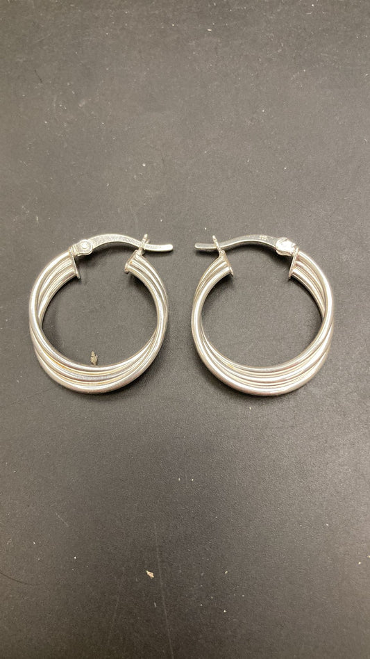 Sterling silver huggies earrings featuring a stylish patterned design, ideal for everyday wear.