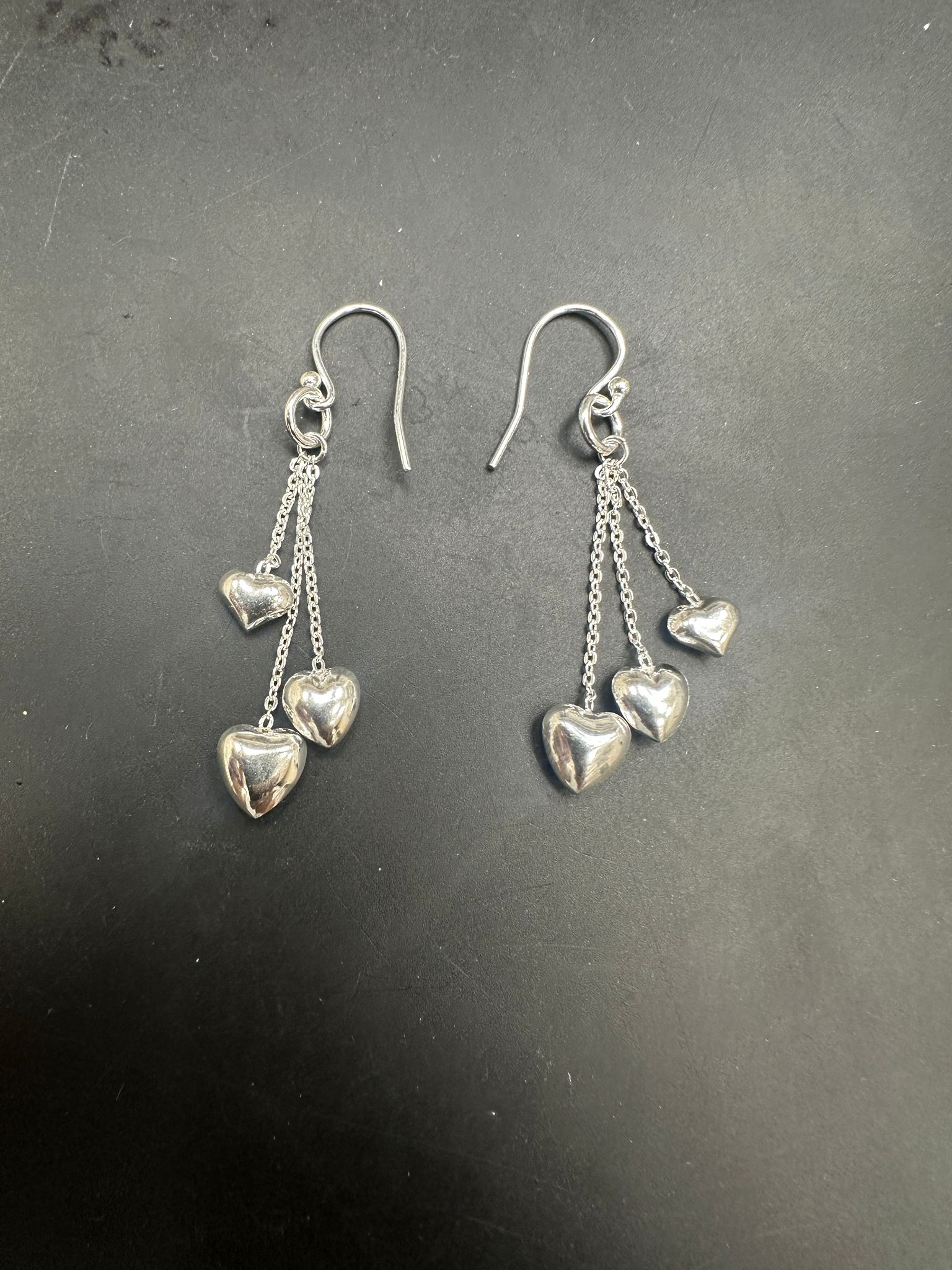 Sterling Silver Drop Earrings EP124 featuring heart charms on elegant chains.