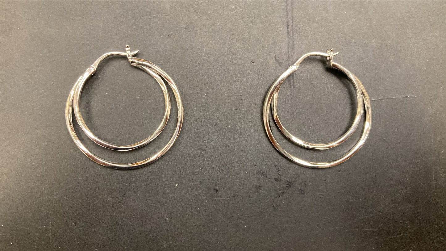 Sterling silver double wire hoop earrings EP701 displayed from the front on a dark surface.