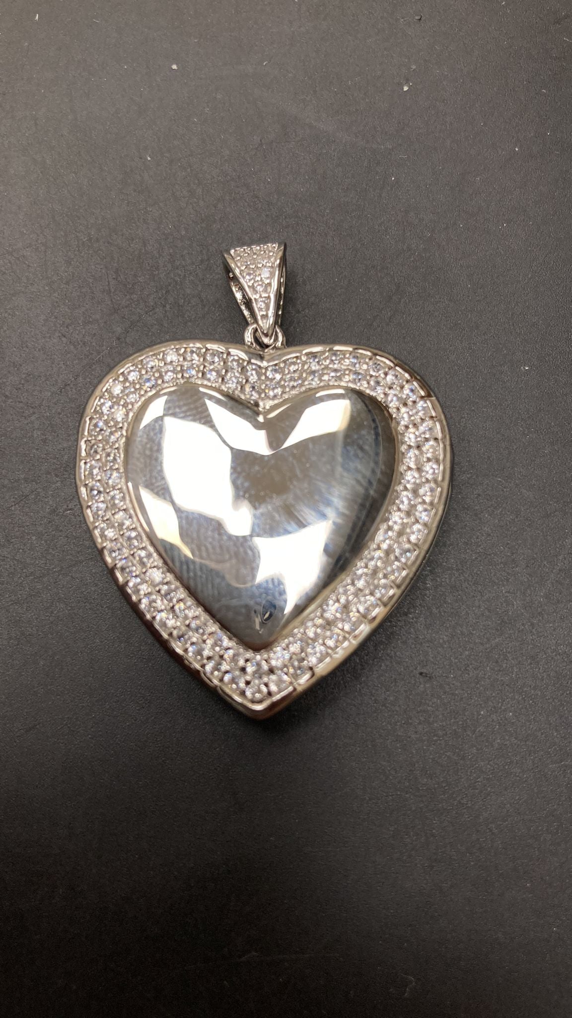 Sterling silver heart pendant with CZ stones, featuring a locked heart shape design, LK101.
