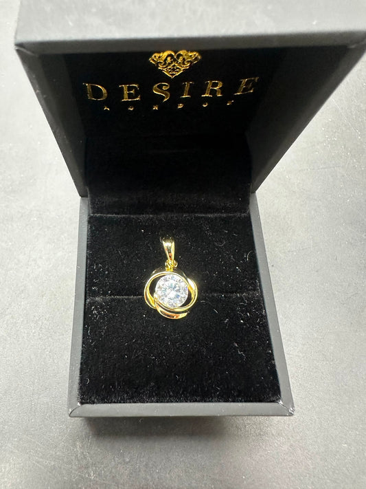 Sterling silver cz pendant displayed in a luxurious black and gold Desire packaging with a sparkling centerpiece.
