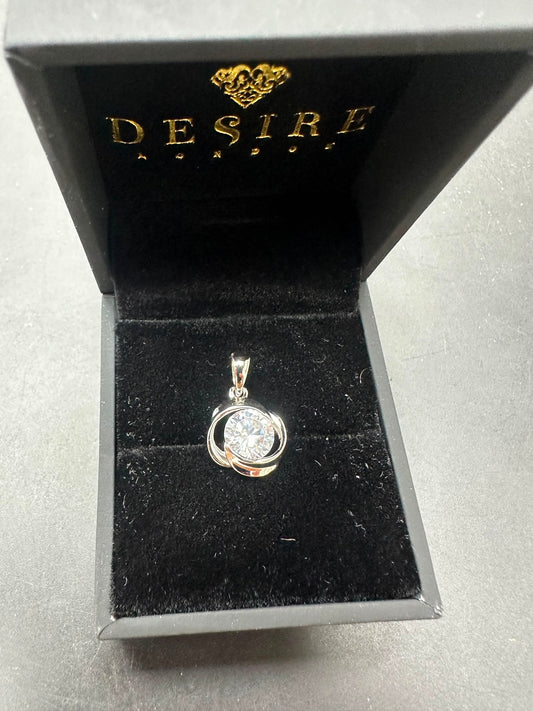 Sterling silver cz pendant displayed in a black jewelry box, featuring a round cz stone.