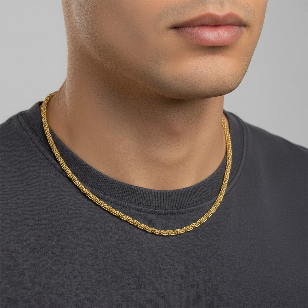 Gold chain on a black background with a ruler at the bottom