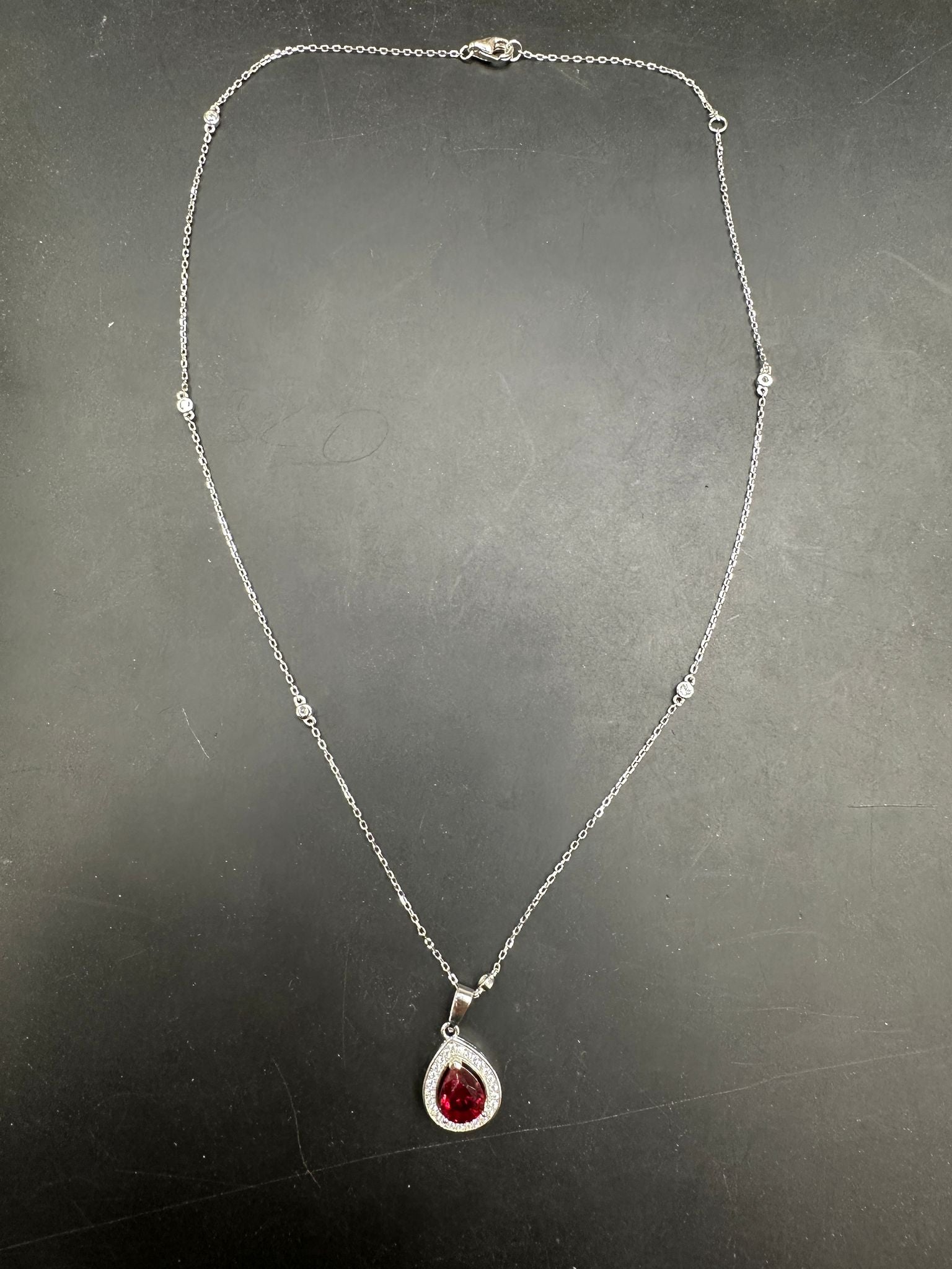 Sterling Silver Cz Pear Shape Necklace NCZ019 showcasing a beautiful pear shape cz necklace with a red pendant.