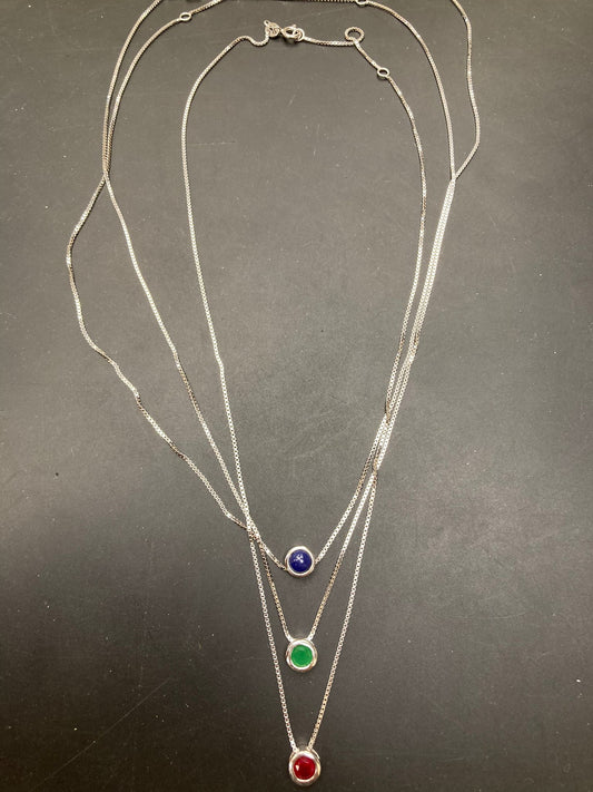 Sterling Silver Triple Rubover Necklace NCZ020 with colored stones on a black background.