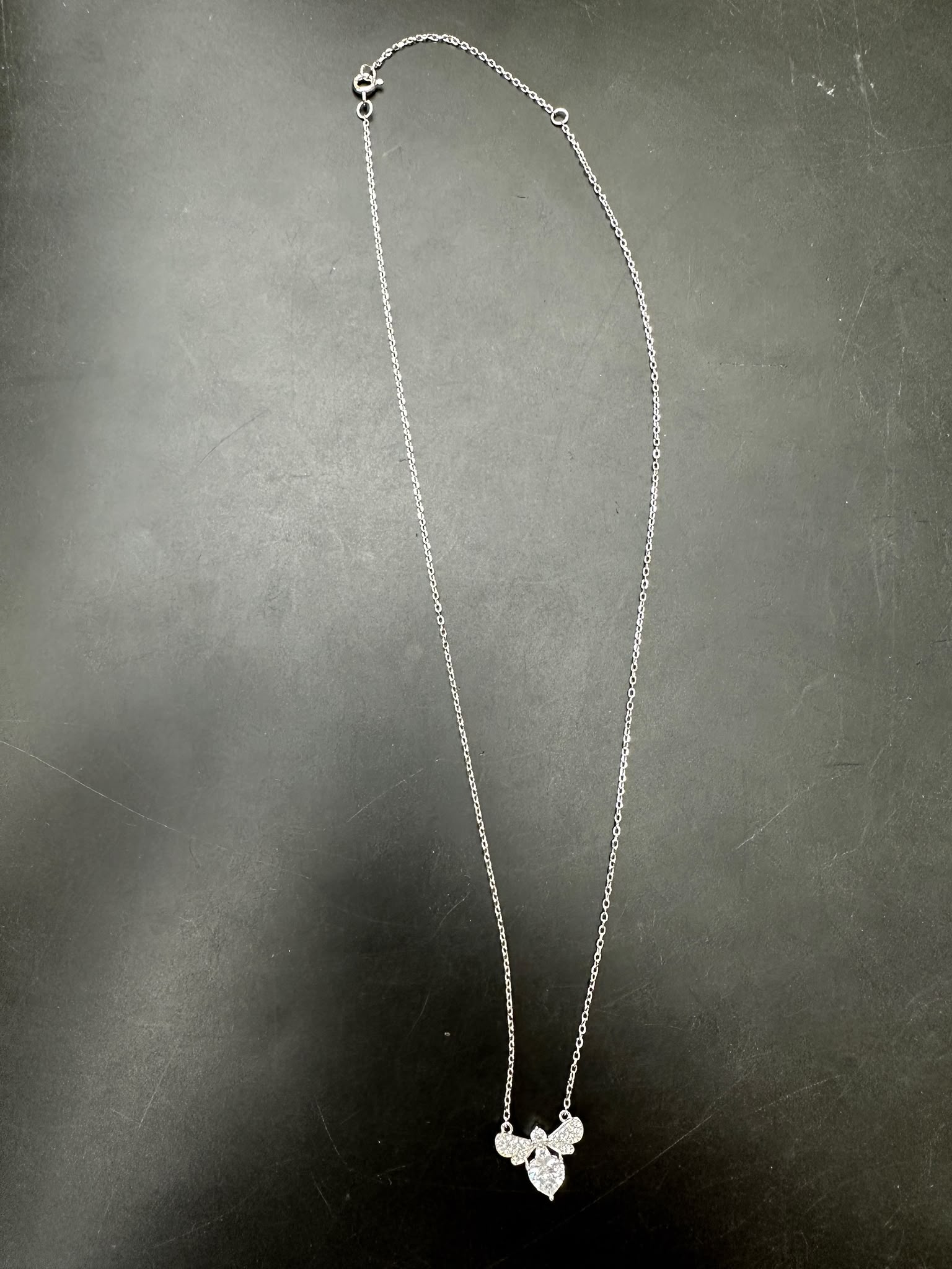 Sterling silver bee necklace NCZ0940 featuring a delicate bee design with sparkling accents.