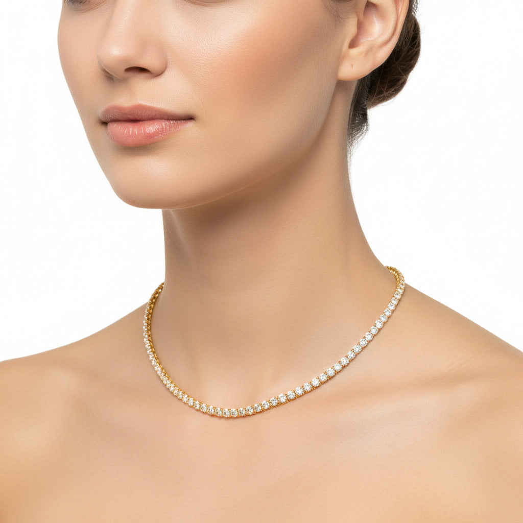 Gold on silver tennis necklace with clear stones on a 