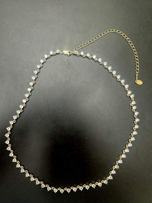 Sterling silver cz stone necklace featuring round 3.0mm cz stones, elegantly gold plated for a luxurious look.