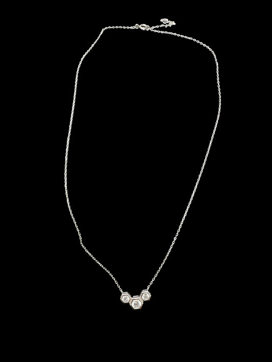 Sterling silver cz stone necklace featuring a unique design with three sparkling stones, 4.0mm and 5.0mm details.