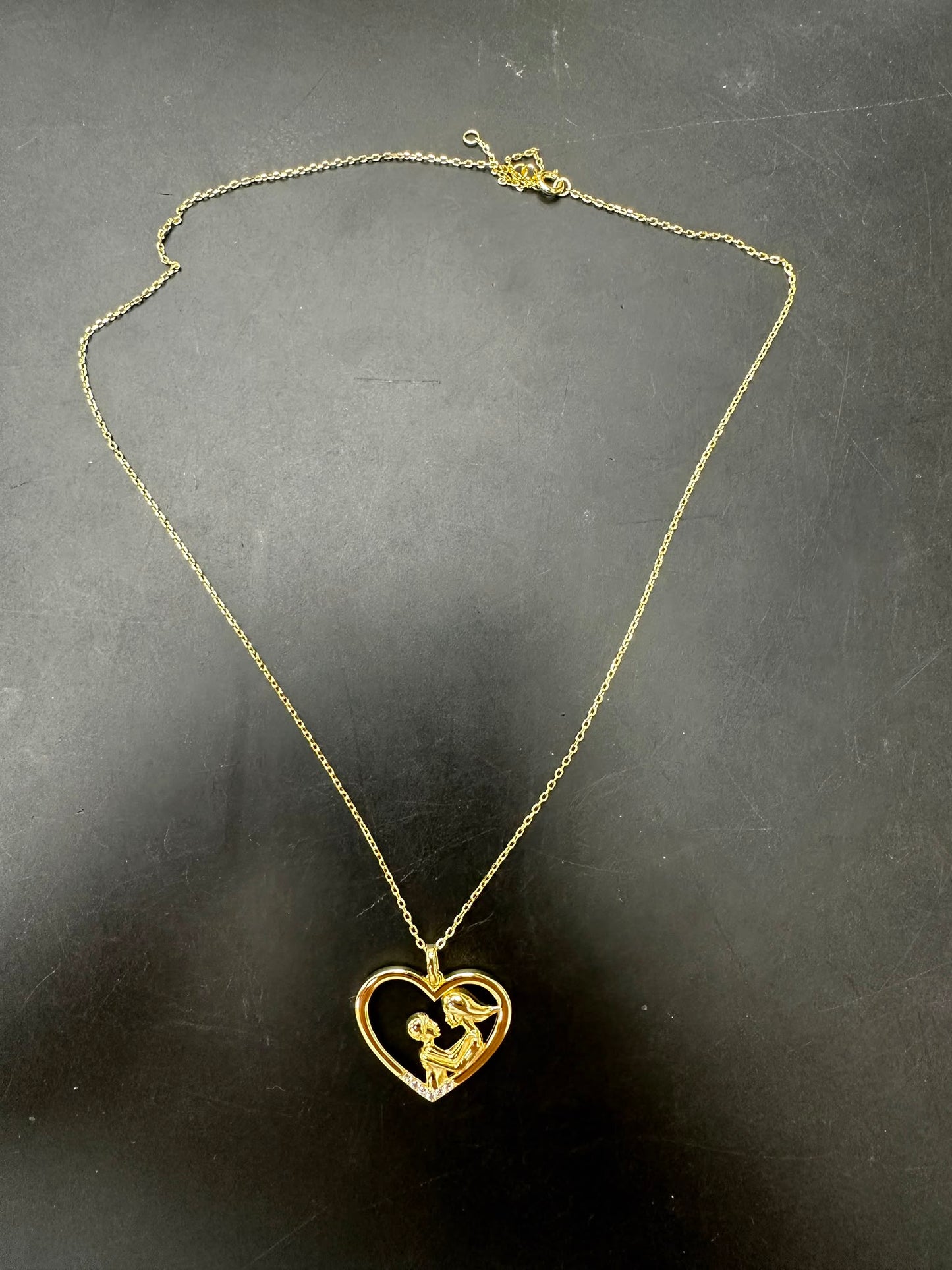 Sterling silver mother child necklace in gold plated heart design, ideal for gifts and special occasions.
