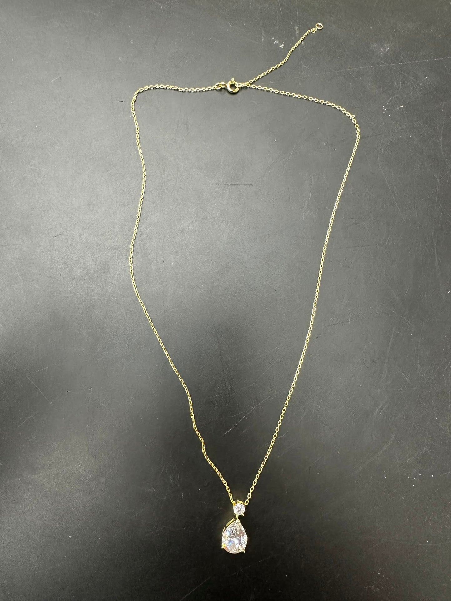 Pear cut sterling silver necklace with beautiful teardrop pendant on a sleek chain.