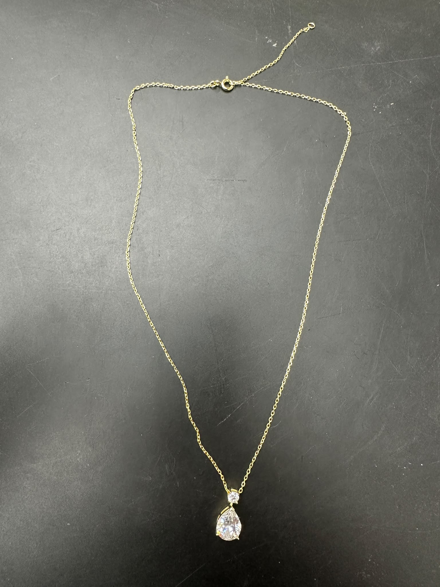 Pear cut sterling silver necklace with beautiful teardrop pendant on a sleek chain.