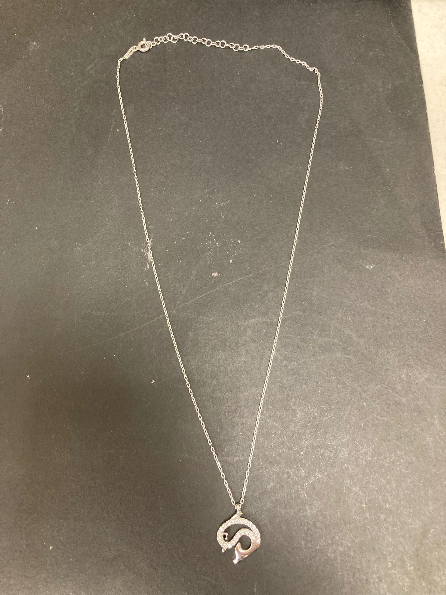 Sterling Silver Cz Dolphin Necklace NCZ9101 showcasing a dolphin design, perfect for ocean lovers. sterling silver dolphin necklace.
