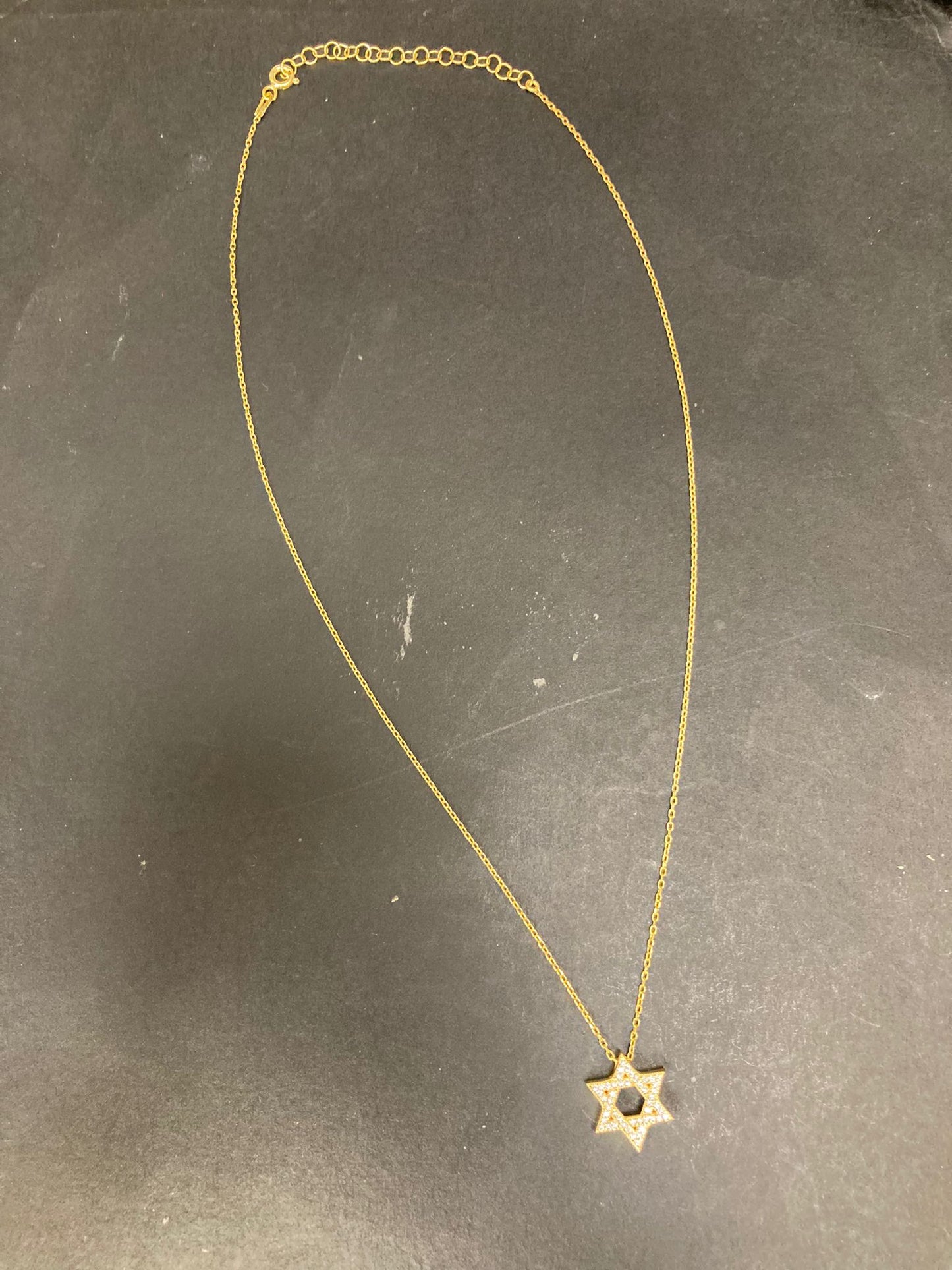 Sterling Silver Star of David Necklace NCZ9102 displayed on a black surface with a delicate chain design.