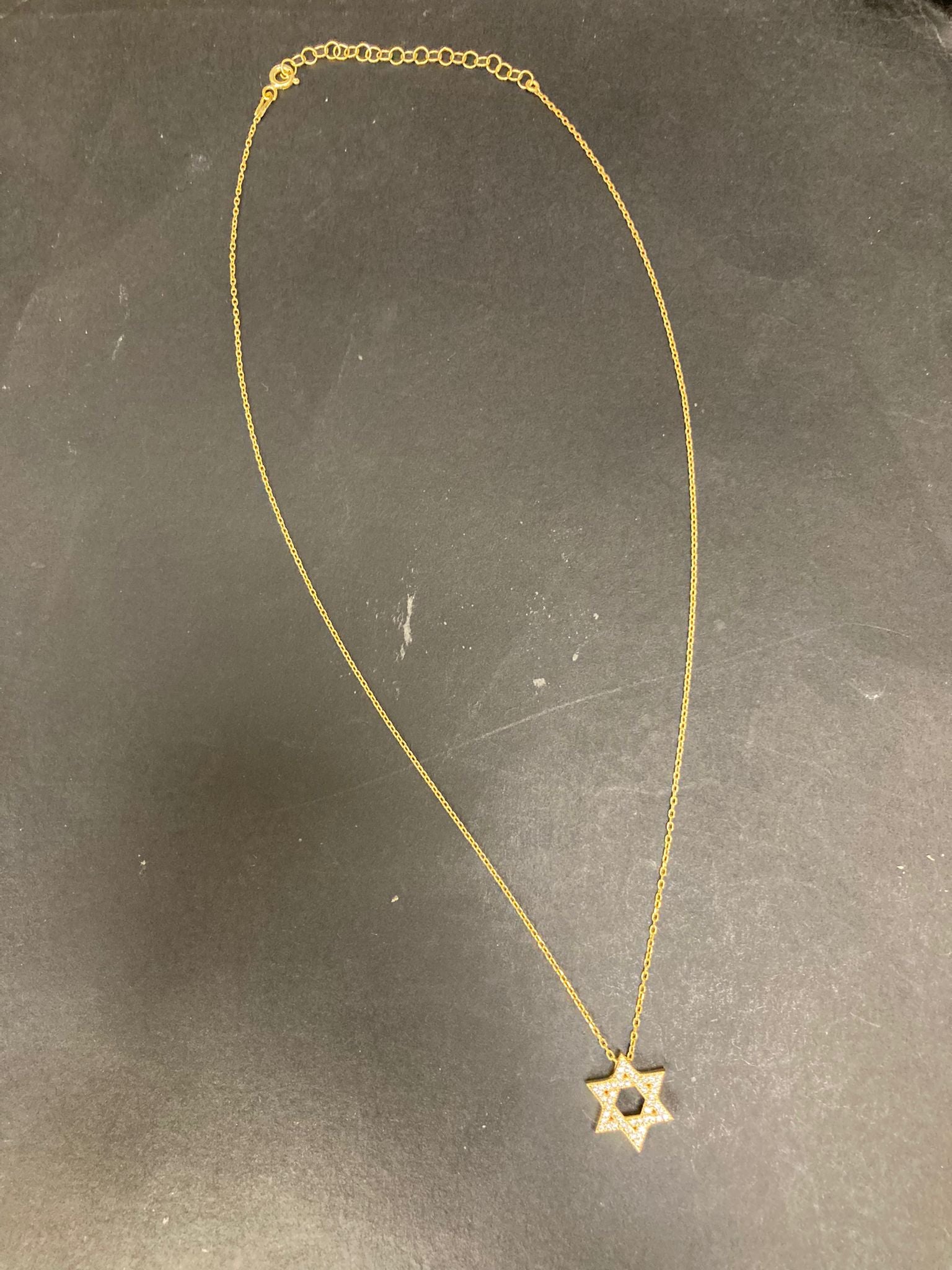 Sterling Silver Star of David Necklace NCZ9102 displayed on a black surface with a delicate chain design.