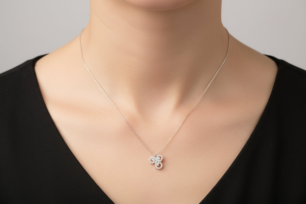 Sterling Silver Necklace with CZ cluster pendant, showcasing elegance in a close-up view.