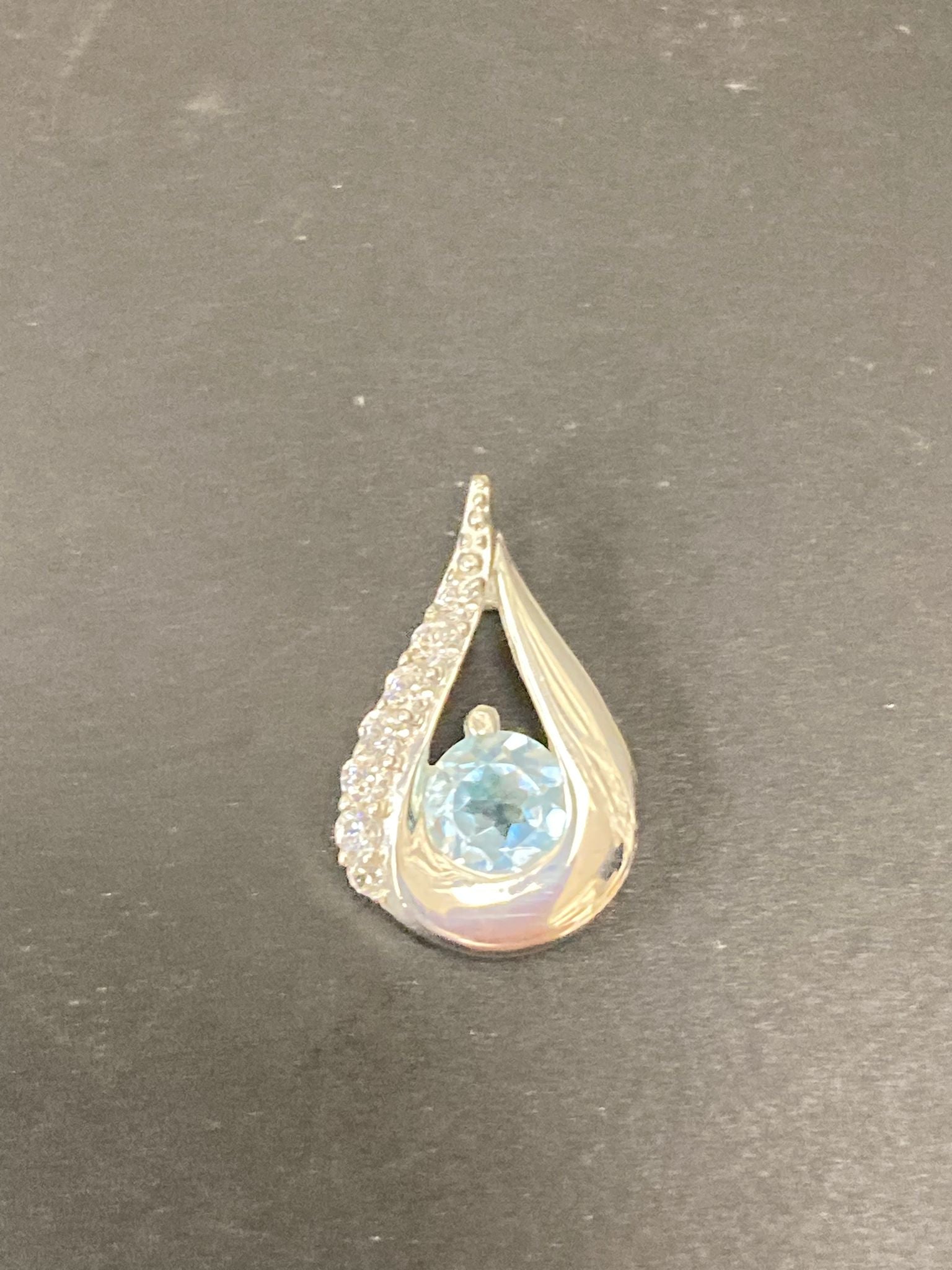 Sterling Silver Cz Pendant PCZ012 featuring a blue gemstone in a teardrop design.