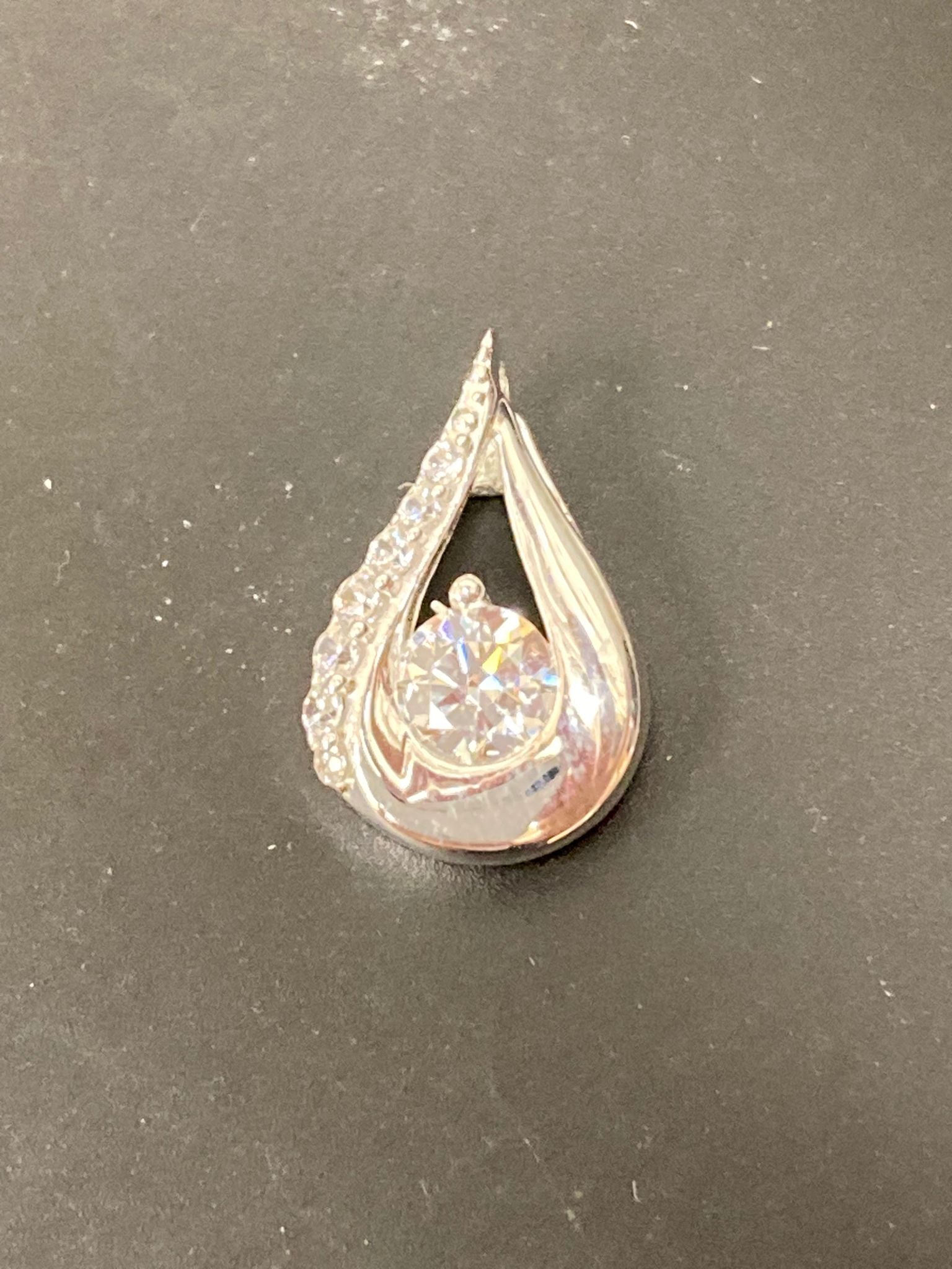 Sterling Silver Cz Pendant PCZ012 featuring a sparkling round cubic zirconia in a teardrop design.