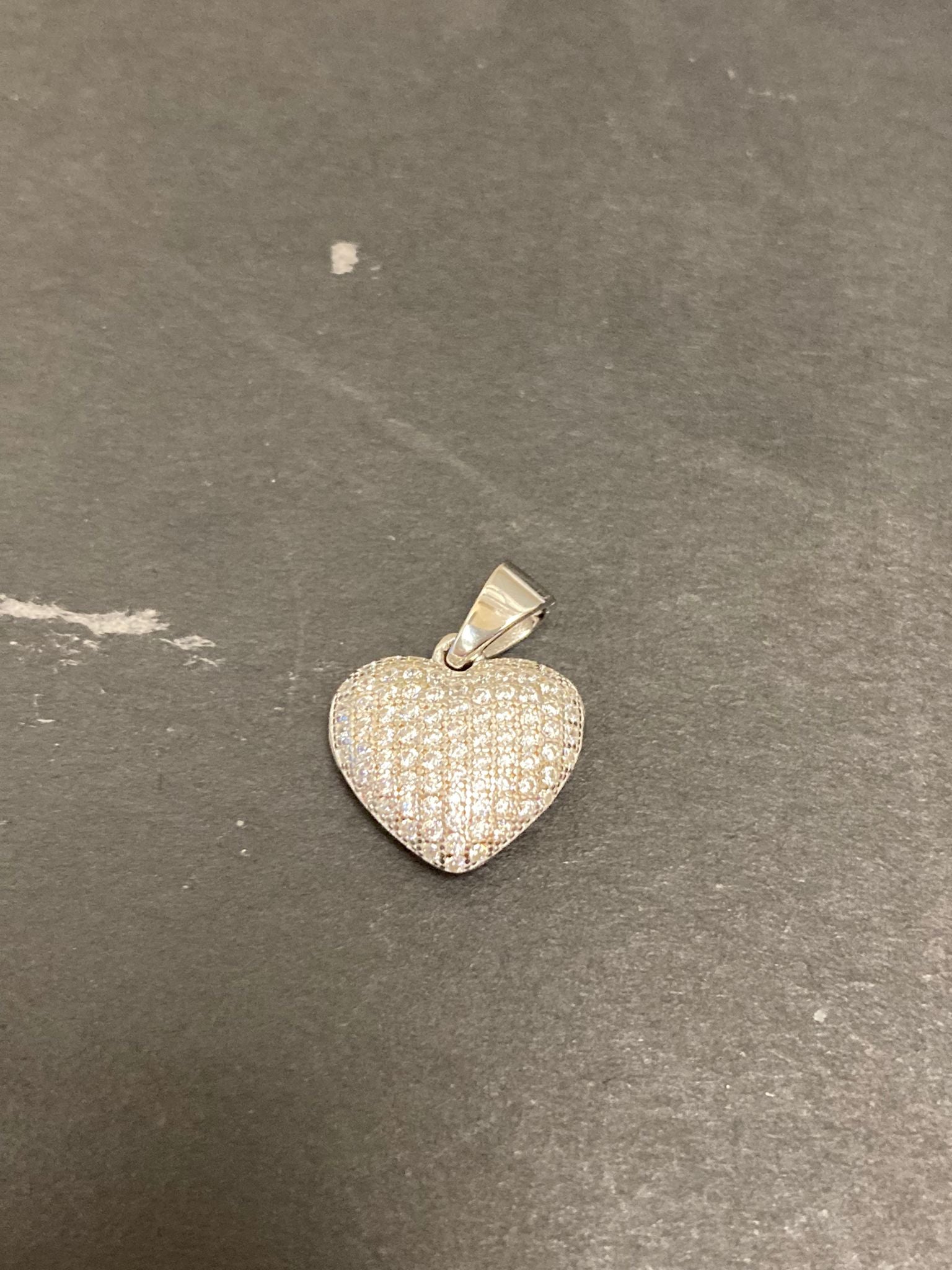 Sterling silver cz heart pendant PCZ116 featuring a sparkling design on a heart-shaped charm.