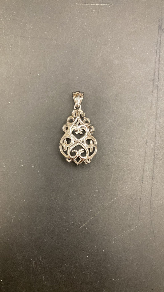 Trifari sterling silver filigree pendant featuring intricate design and elegant details.