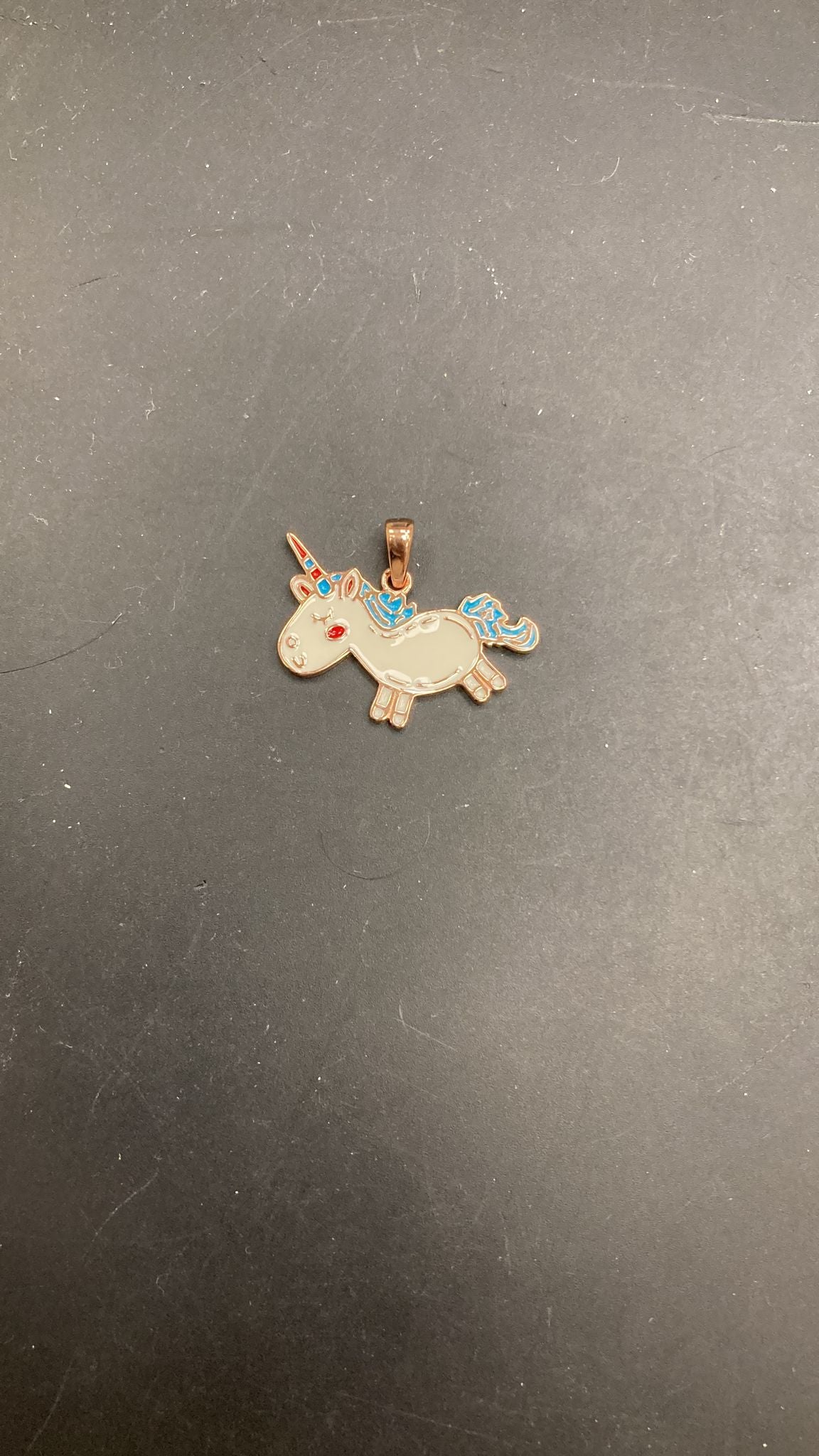 Sterling Silver Unicorn Pendant PCZ6012 showcased against a dark background.