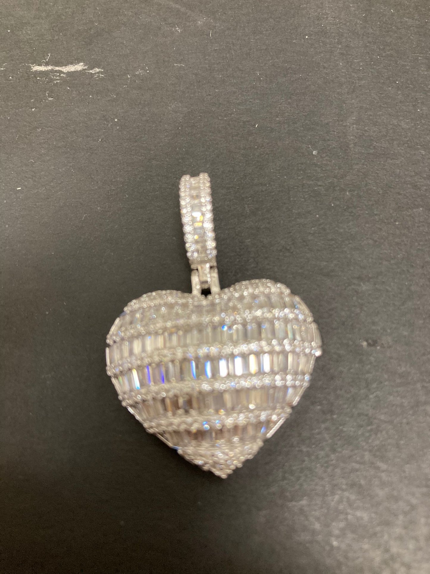 Heart shape sterling silver pendant with intricate design, perfect for jewelry lovers.