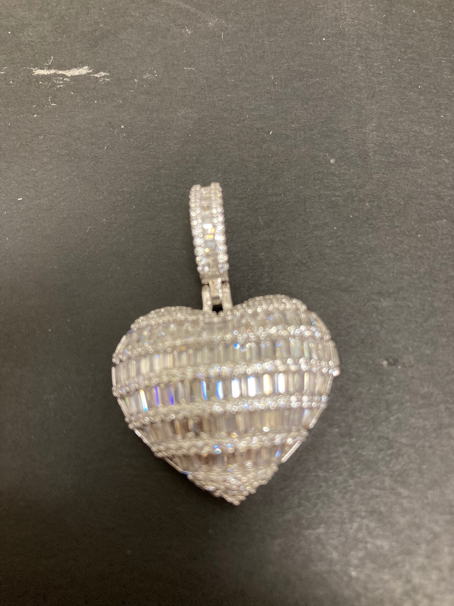 Heart shape sterling silver pendant with intricate design, perfect for jewelry lovers.