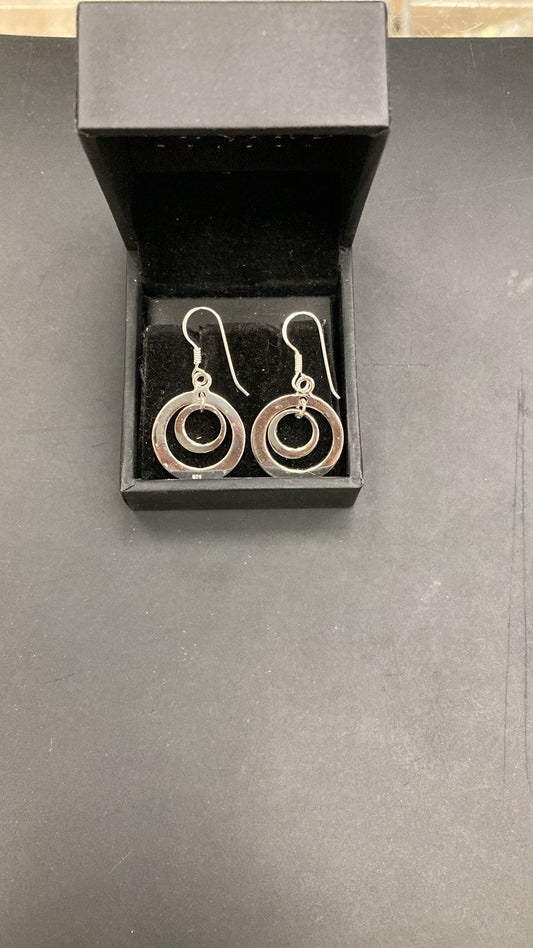 Sterling Silver Concentric Circle Dangle Earrings PE010480309 in a black box, showcasing sterling silver dangle earrings.