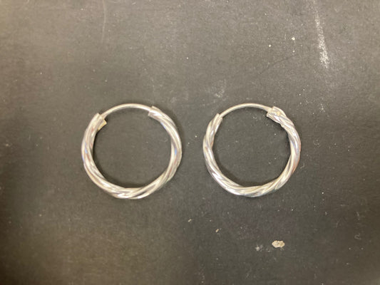 Sterling Silver Twist Hoop Earrings PE011590021 on a black background showcasing their elegant design.