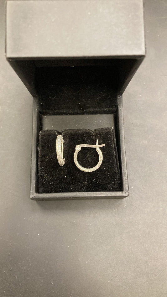 Sterling Silver Cz Hinged Hoop Earrings PE019250507 displayed in a black jewelry box.