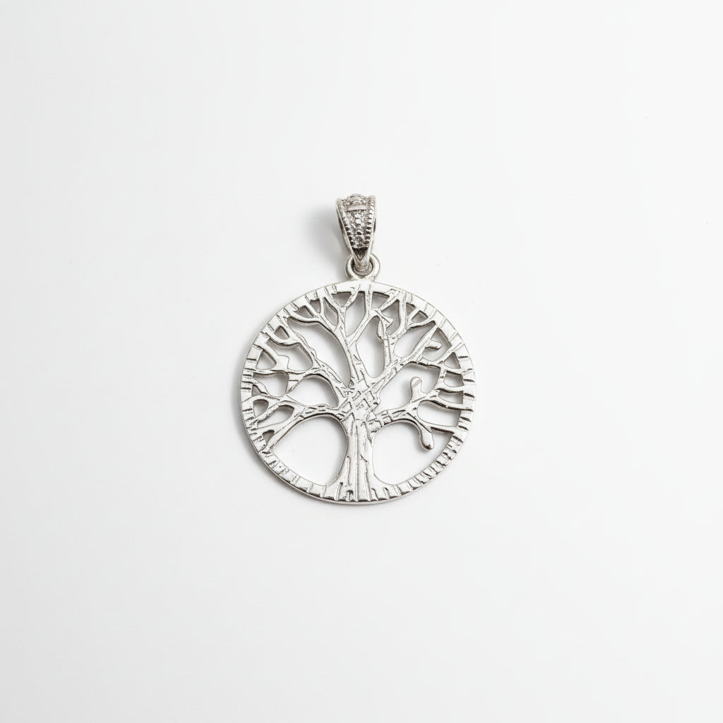 Sterling silver tree of life pendant reflecting intricate design and craftsmanship.
