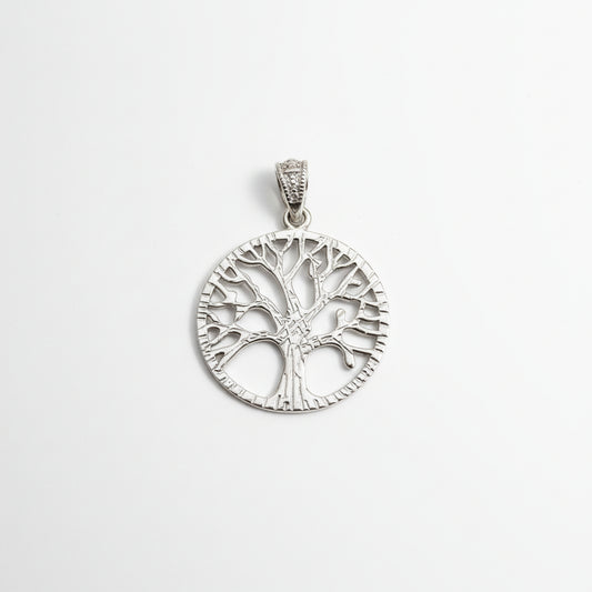 Sterling silver tree of life pendant reflecting intricate design and craftsmanship.