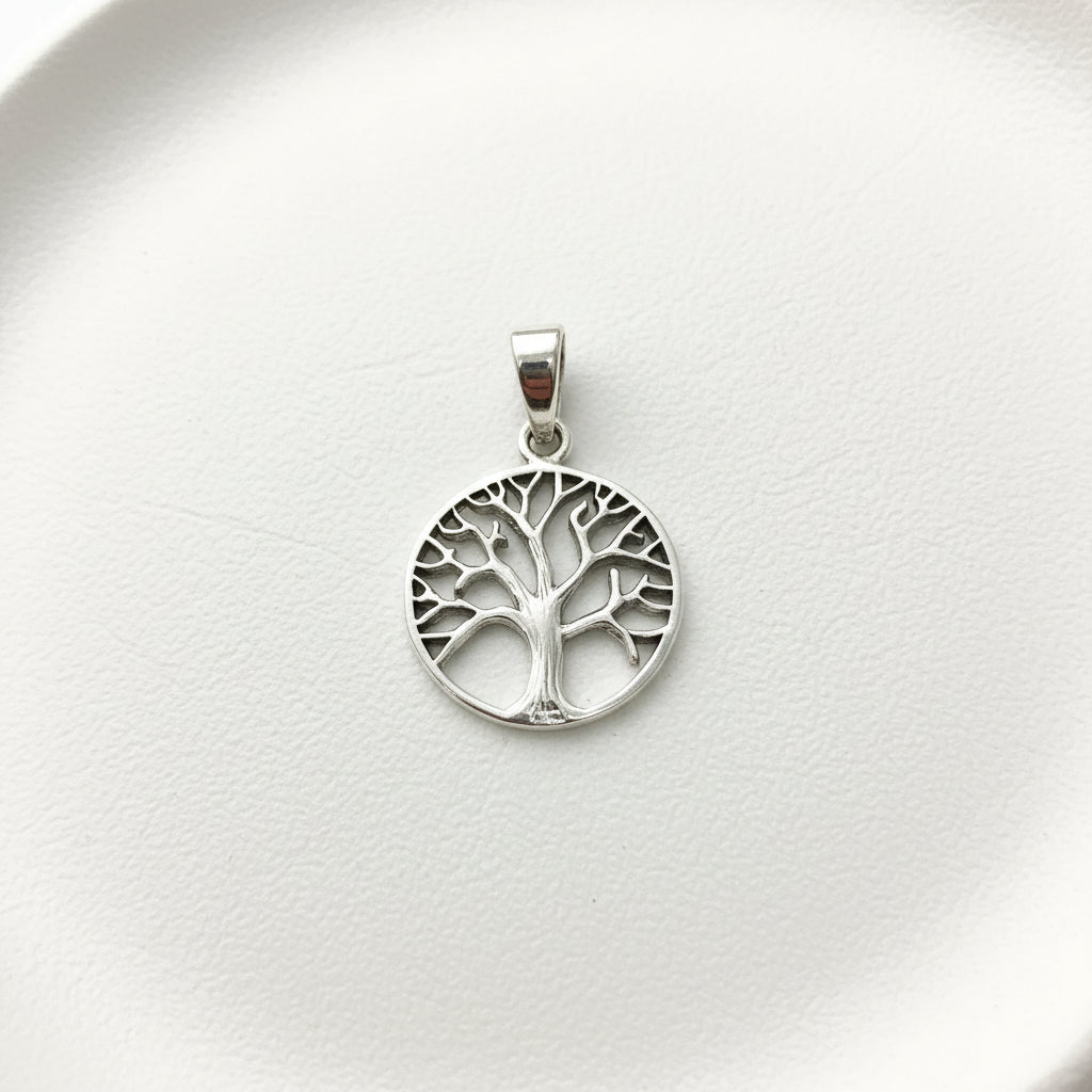 Sterling Silver Plain Tree of Life Pendant PP021270071 displayed on a plate, featuring intricate tree design.