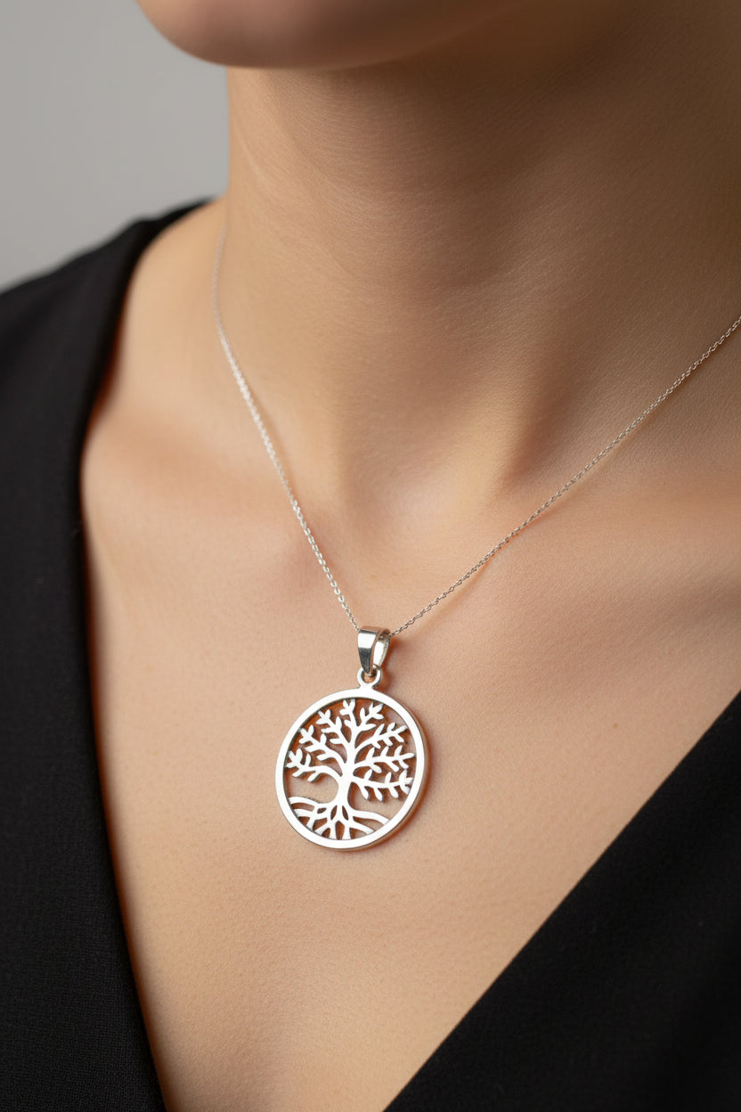 Sterling Silver Tree of Life Pendant showcased on a model's neck in a close-up shot.
