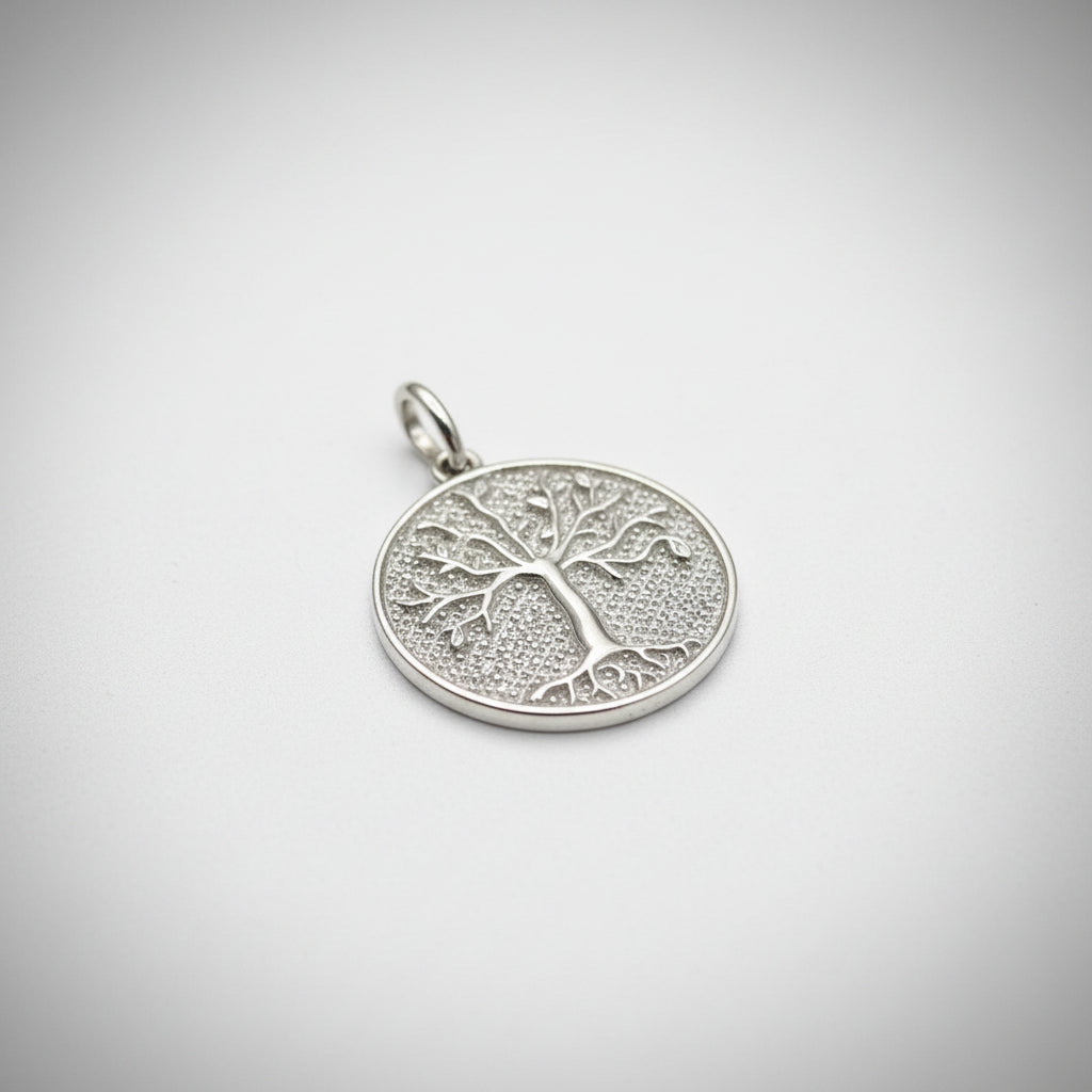 Sterling silver tree of life pendant with intricate tree design and polished finish.