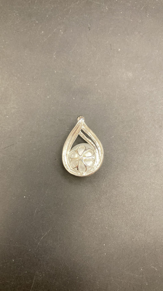 Sterling silver pearl pendant featuring a unique floral design in an elegant teardrop shape.