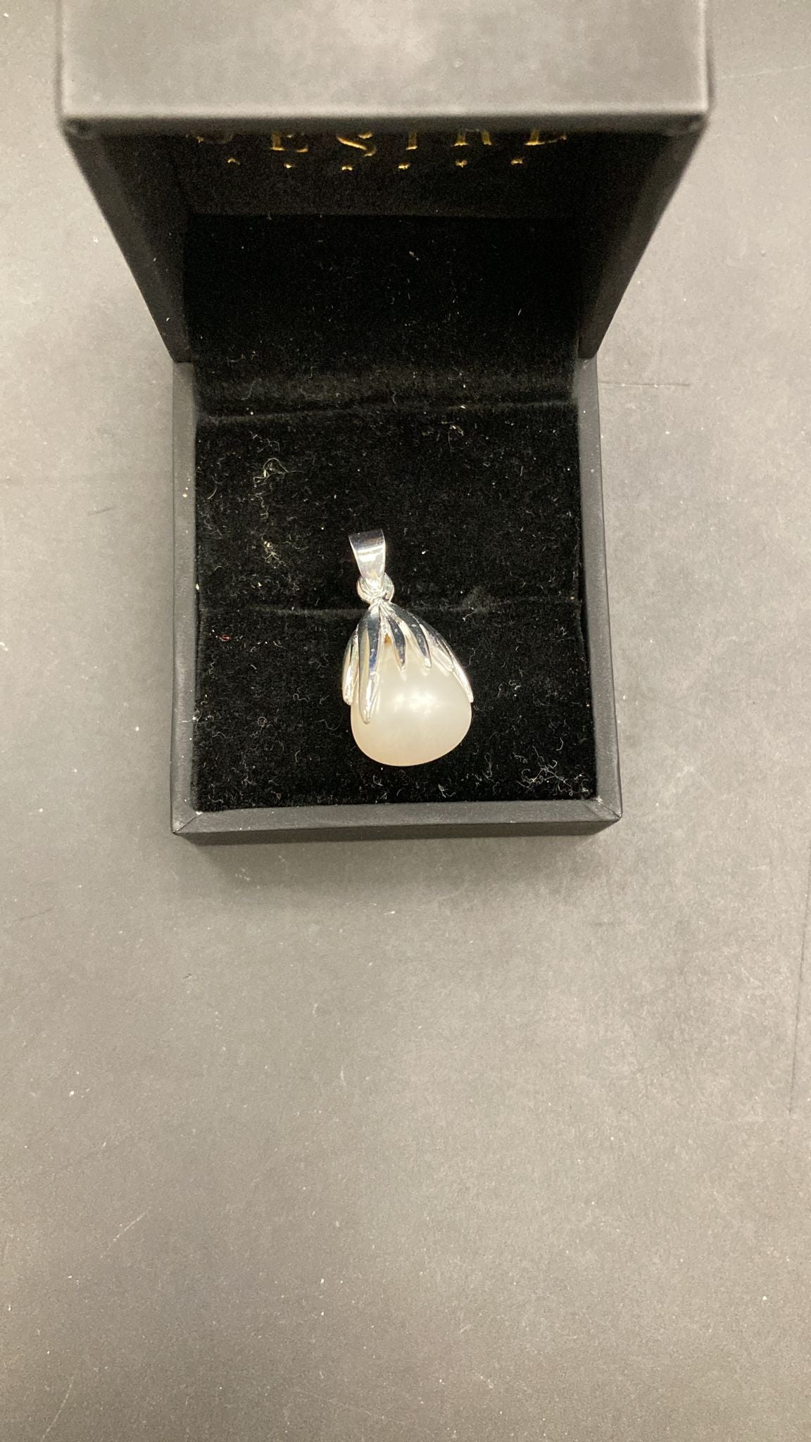 Sterling Silver Pearl Pendant PP121150102 displayed in a black jewelry box.