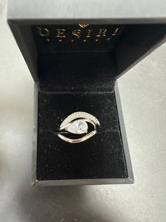 Sterling silver triple ring cz stone in elegant box with round cz stone center.