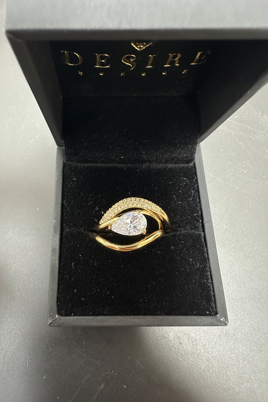 Sterling silver triple ring cz stone in a desire box with a round CZ stone and gold plating.