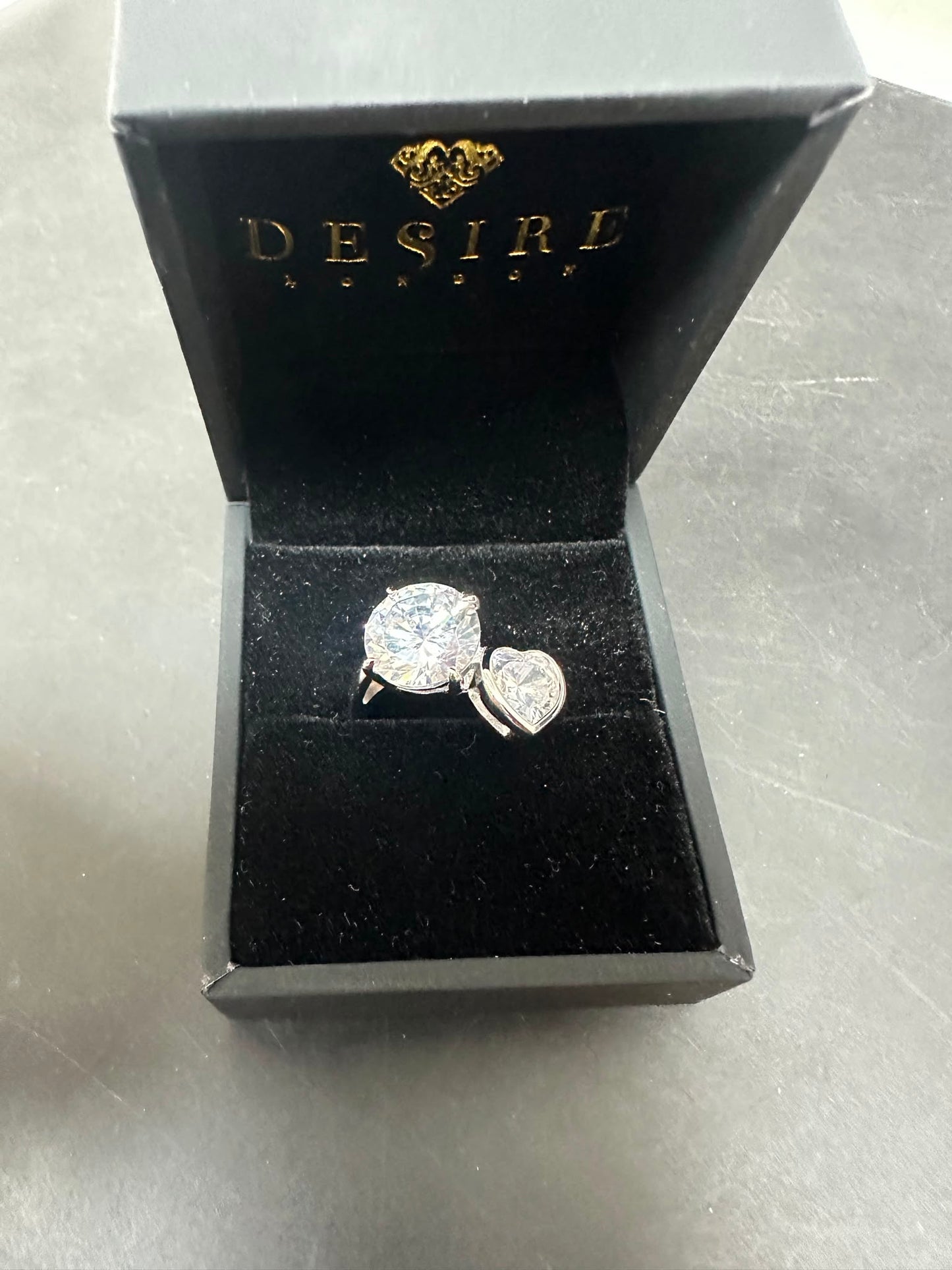 Sterling silver toi et moi ring with CZ stones in a luxury box, round and heart-shaped stones.