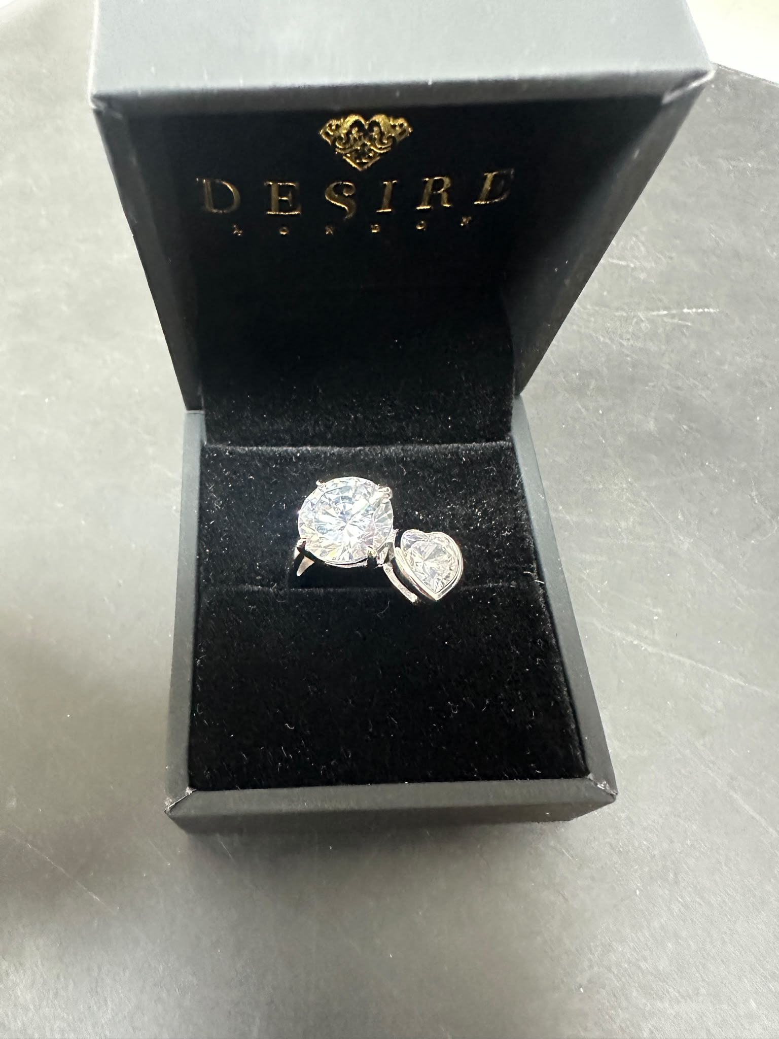 Sterling silver toi et moi ring with CZ stones in a luxury box, round and heart-shaped stones.