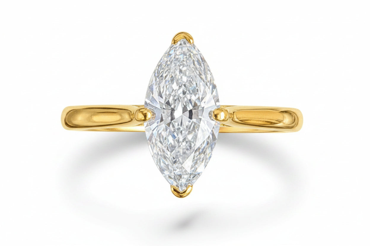 Sterling silver marquise ring with CZ stone, featuring a 6x12mm centerpiece and gold plating.