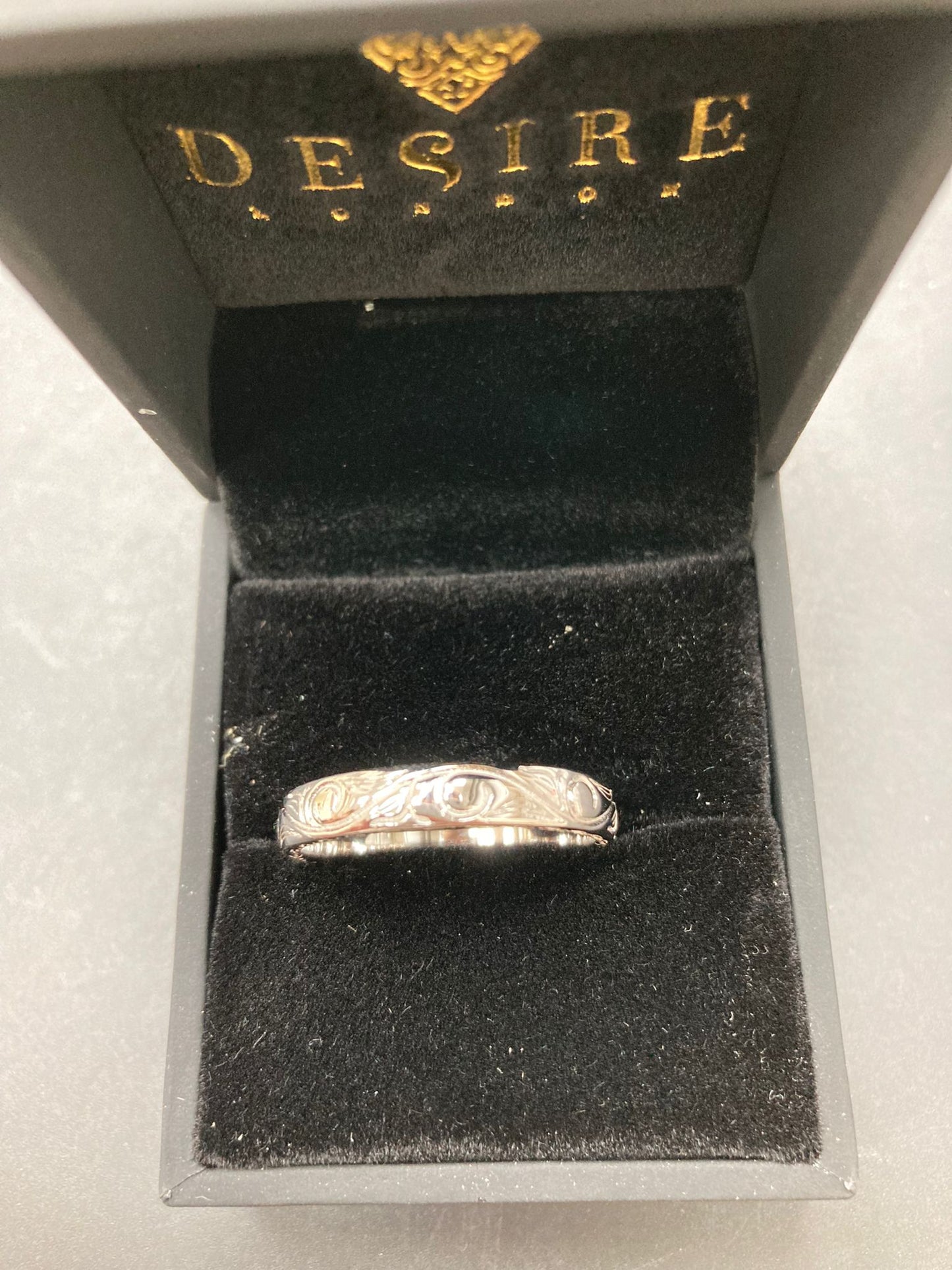 Sterling Silver Floral Vine Engraving Ring RP002 displayed in a luxurious box, showcasing the sterling silver floral vine ring.