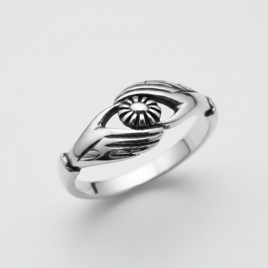 Plain sterling silver ring featuring a unique handmade design with a sun emblem.
