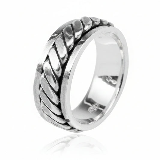 6mm sterling silver spinner ring with braided design, reflecting light elegantly.