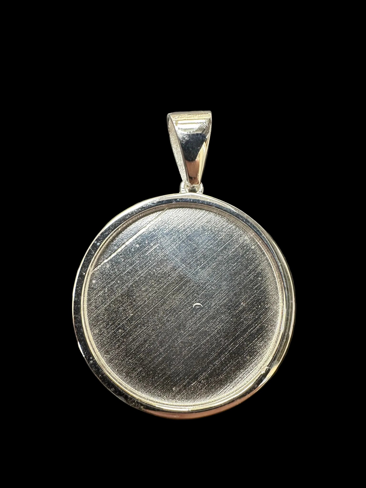 Plain sterling silver memory pendant featuring a smooth, polished surface and elegant design.