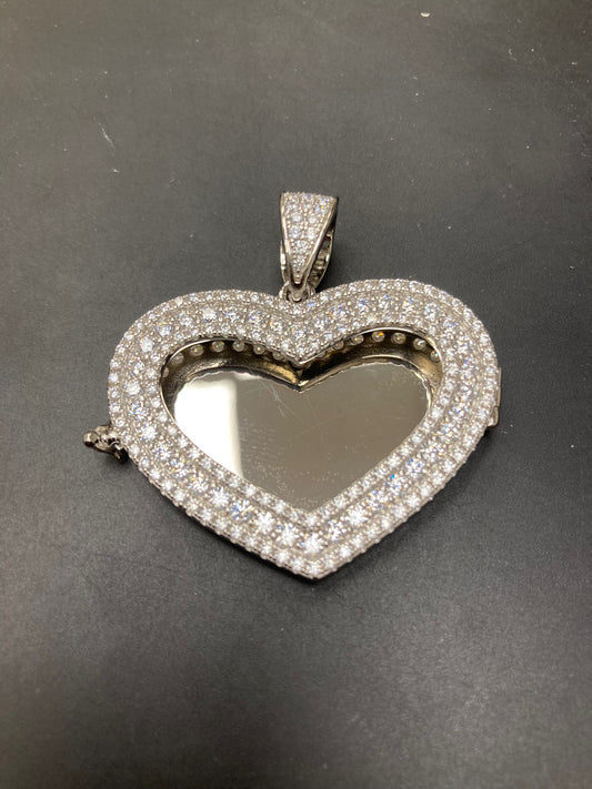 Sterling silver heart pendant with cz stone, featuring a dazzling heart-shaped design and shimmering cubic zirconia accents.